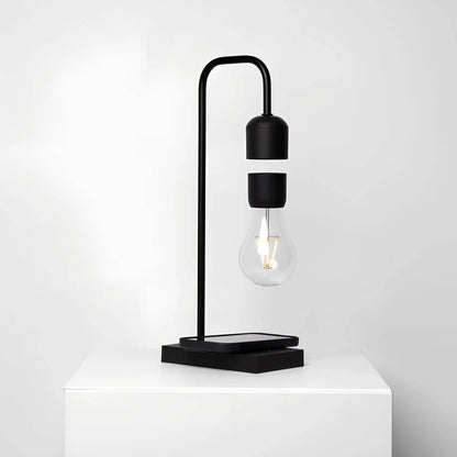 Minimalistische Leviterende LED-lamp met draadloze oplader voor mobiele telefoon